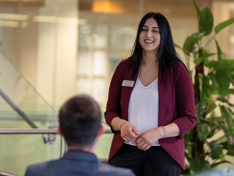 A friendly advisor speaking to a student.